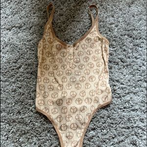 Urban outfitters peace sign body suit